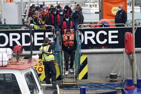 A group of people thought to be migrants are brought in to Dover, Kent, following a small boat incident in the Channel