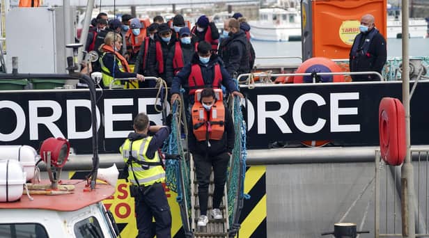 A group of people thought to be migrants are brought in to Dover, Kent, following a small boat incident in the Channel