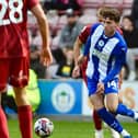 Chris Sze is currently sorting out 'personal issues' but will be back in the Latics fold before long, says Shaun Maloney