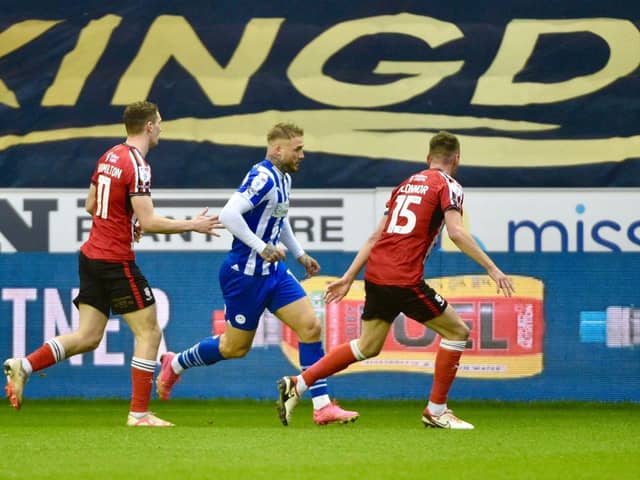 Stephen Humphrys struggles to find a way through against Lincoln