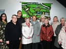 Jo Mitchell, customer experience and support manager at Wigan Life Centre, Coun Chris Ready and Paul Molyneux, a volunteer at the community centre, with members of the Daisy Chain Stitchers