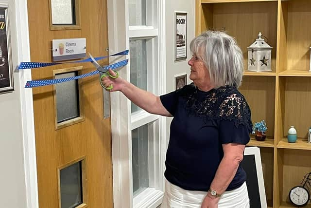 Carol Marsh cutting the ribbon