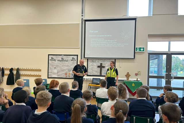 Officers delivering a talk to children at St John's CE Primary School
