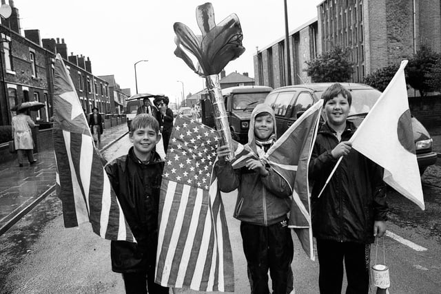 The summer Olympic Games in Spain are commemorated by these lads in the pouring rain at Newtown Gala on Saturday 8th of August 1992.