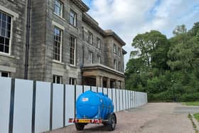 The fence has been moved at the front of Haigh Hall, all of six feet nearer, what is occurring?
