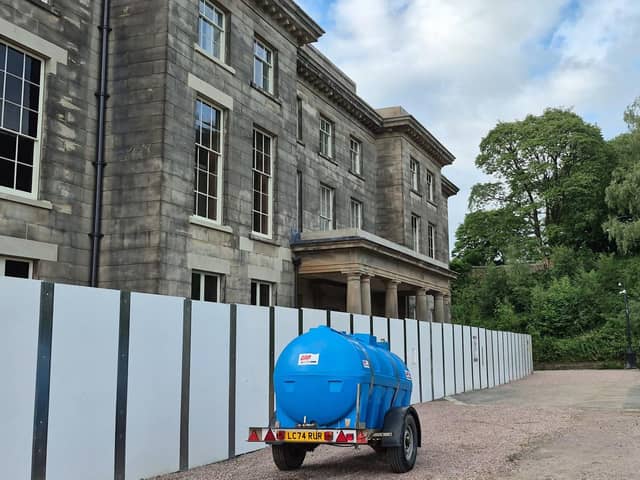 The fence has been moved at the front of Haigh Hall, all of six feet nearer, what is occurring?