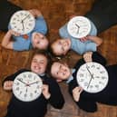 Year six pupils at Our Lady's RC Primary School, Aspull, reminding readers that clocks go forward by one hour this weekend