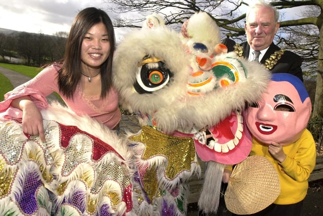 The fierce Chinese lion proved quite friendly to the Mayor of Wigan Coun Geoff Roberts and student Lizhu Ren when it appeared at Wigan and Leigh College