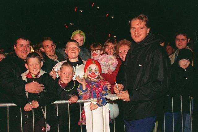 RL star Simon Haughton signs autographs at a bonfire party in Park Lane, Abram, in 1997