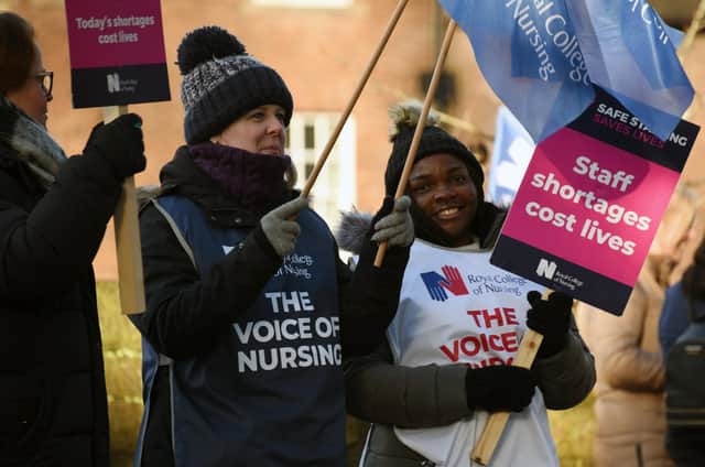 Nurses carried placards and flags on the picket line