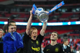 Ben Watson celebrating with the FA Cup