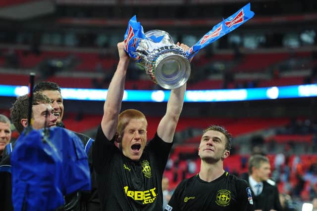 Ben Watson celebrating with the FA Cup