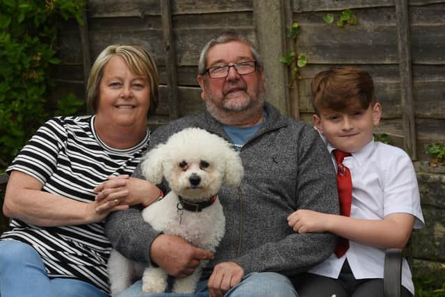 Retired postman Mick Marsh with wife Doreen, grandson Archie, eight, and dog Fergie