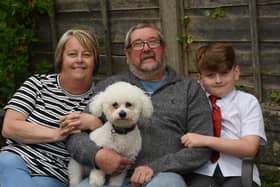 Retired postman Mick Marsh with wife Doreen, grandson Archie, eight, and dog Fergie