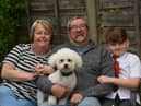 Retired postman Mick Marsh with wife Doreen, grandson Archie, eight, and dog Fergie