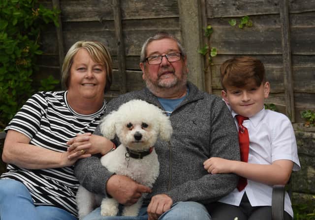 Retired postman Mick Marsh with wife Doreen, grandson Archie, eight, and dog Fergie