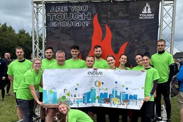 The Evolve team completes the Tough Mudder 10K obstacle course.