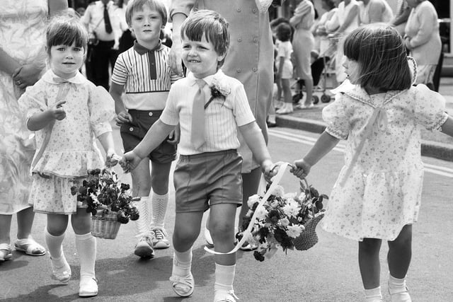A stroll in the sunshine for children taking part in the Wigan Parish Church walking day on Sunday 29th of June 1986.