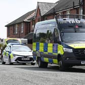 Police at the scene at a property on Crankwood Road, Abram, after two houses in Wigan were raided in a counter-terrorism investigation.