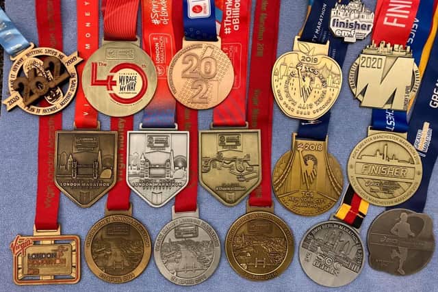 Carol's marathon medals.