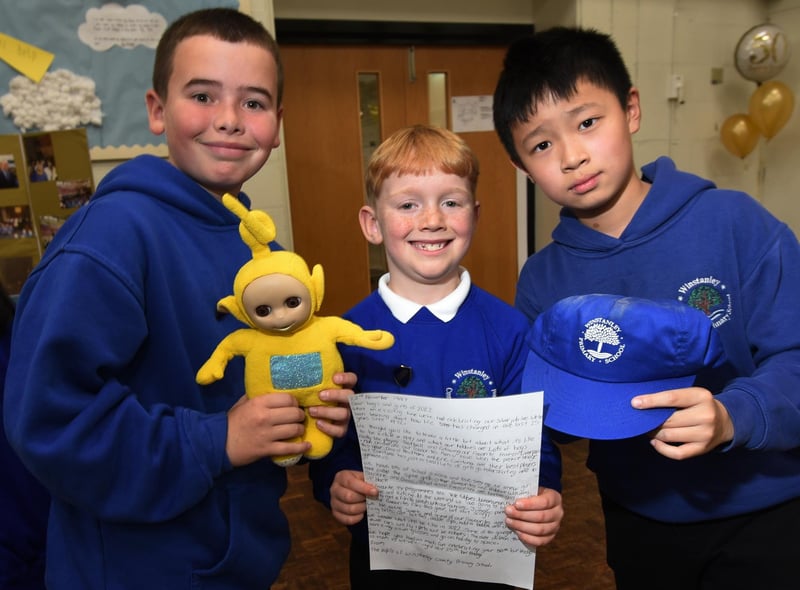 Members of the school council with some of the items from the time capsule, with a cassette tape of The Spice Girls, Tamagotchi (handheld digital pet popular in 1997),  school work, letters and newspapers from the day.