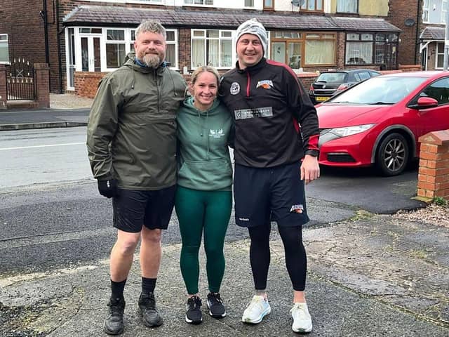 Jamie Dallimore (right) is joined by regular running companion Dean Byrom (left) and Steph Phillips on his daily 10k fundraising run