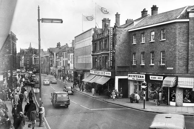 The lower end of Standishgate in 1966. Prominent are the C&A store, Mark Williams butchers, Hunters chemist and Bellmans Wools.
