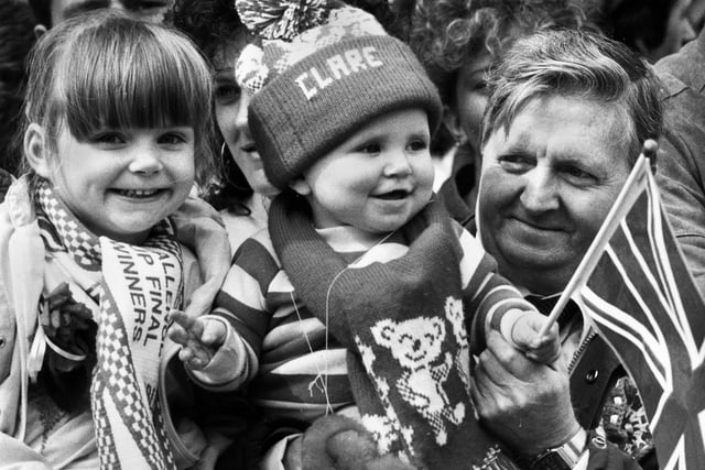 Robert Mills with his 10 month old grandaughter Clare welcoming home the Wigan team on Sunday 1st of May 1988 after their Wembley triumph. 