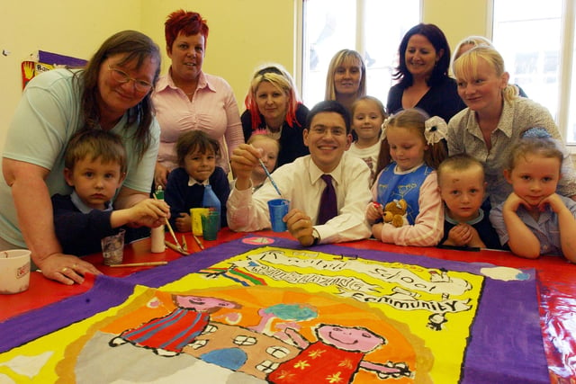 A 2004 view of a painting session, showing students joining MP David Miliband as they created a miners-style banner.