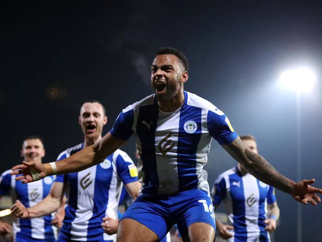 FLEETWOOD, ENGLAND - NOVEMBER 02: Curtis Tilt of Wigan Athletic celebrates after scoring their side's third goal during the Sky Bet League One match between Fleetwood Town and Wigan Athletic at Highbury Stadium on November 02, 2021 in Fleetwood, England. (Photo by Lewis Storey/Getty Images)