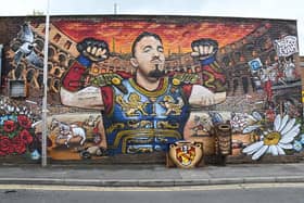 The new mural celebrating UFC champion and local hero Tom Aspinall on the side of Mediterranean Fish Bar in Atherton