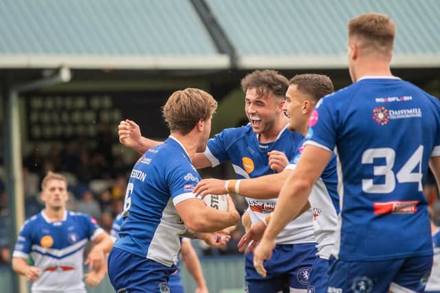 Swinton’s Nick Gregson celebrating his try with teammates