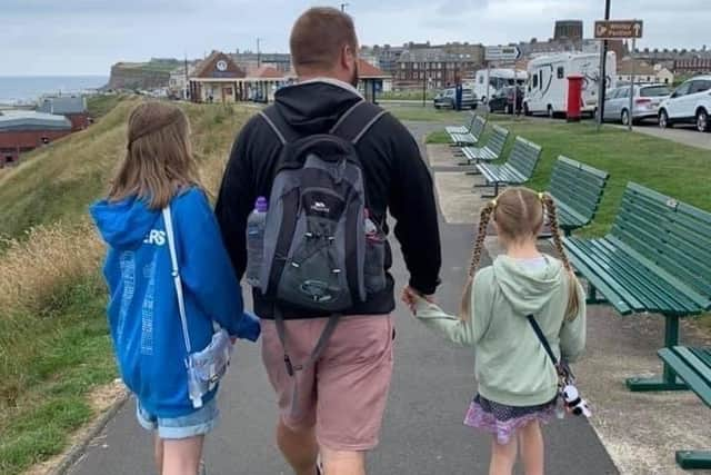 Darren with his two daughters before his stroke.