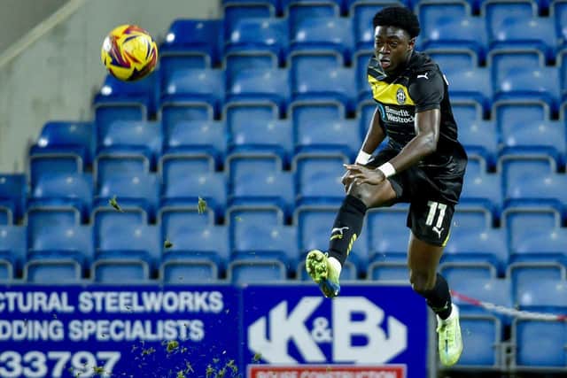 Michael Olakigbe in action for Latics at Chesterfield in the Vertu Trophy last month