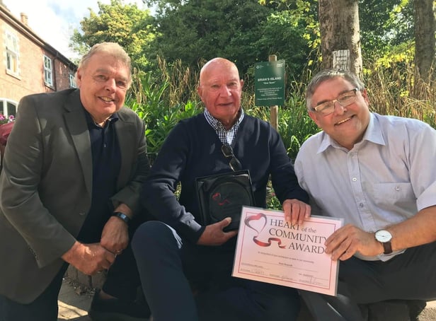 Volunteer Brian Muscroft receives the Heart of the Community Award from councillors Ron Conway and Chris Ready