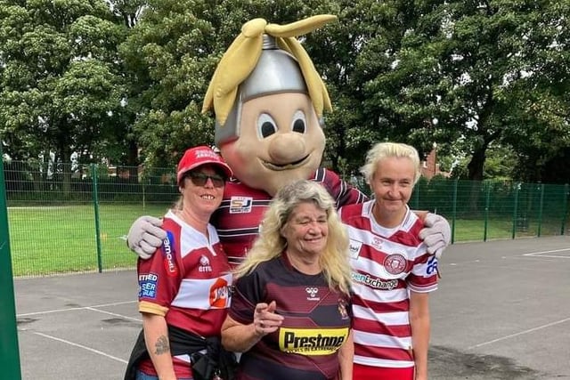 Coun Sylvia Wilkinson along with friends and Wigan Warriors mascot Mighty Max