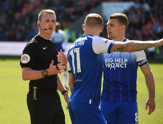 James McClean makes his thoughts very clear to referee Thomas Bramall