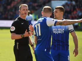 James McClean makes his thoughts very clear to referee Thomas Bramall