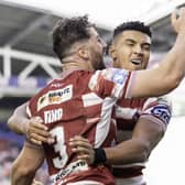 Wigan's Kai Pearce-Paul celebrates with Toby King against Hull KR