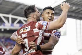 Wigan's Kai Pearce-Paul celebrates with Toby King against Hull KR