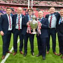 Wigan Warriors owner Mike Danson and his son with the Challenge Cup trophy
