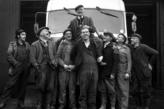 RETRO 1970 - Standish dustman Tommy Jones is held aloft by his fellow workers.