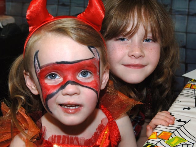 Chloe Stater and Hayley Bowles have their faces painted at Asda in Wigan