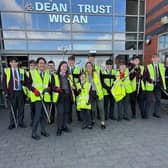 Pupils at Dean Trust Wigan donned high-vis vests to clean up their community.
