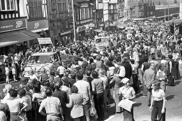 The huge crowd gathered in Standishgate to watch the Wigan Carnival parade pass by in 1977.