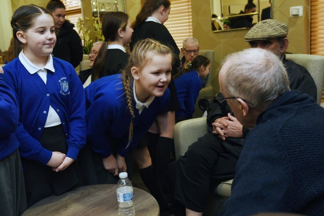 School children from the St Catharine's School Choir meet service users at Central Day Centre, Wigan.