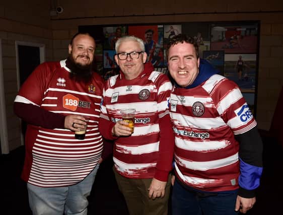 Wigan Warriors fans gather at Robin Park Arena ahead of kick off.