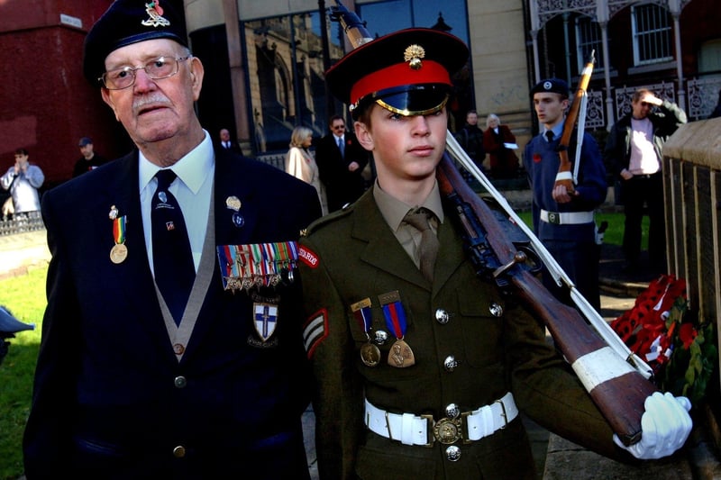 D-Day veteran John Simm of the Royal Artillery with neighbour from Montrose Avenue Grenadier Guards cadet Gareth Whitehill at Wigan cenotaph