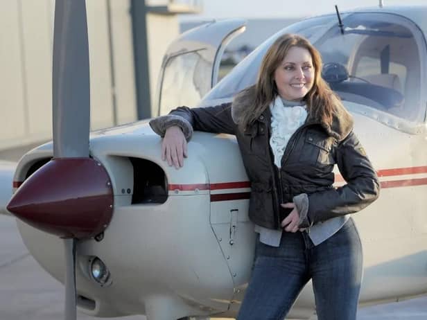 Carol Vorderman with her private plane 'Mildred' after passing her pilot's licence (PPL) test in 2013. (Photo by Tim Ireland/PA Images via Getty Images)