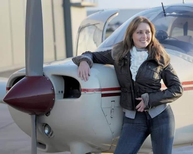 Carol Vorderman with her private plane 'Mildred' after passing her pilot's licence (PPL) test in 2013. (Photo by Tim Ireland/PA Images via Getty Images)